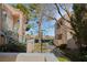 Exterior view of a condo complex with walkways and well-maintained landscaping at 4861 S Torrey Pines Dr # 106, Las Vegas, NV 89103