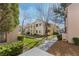 Well-maintained condo complex surrounded by lush landscaping and green grass at 4861 S Torrey Pines Dr # 106, Las Vegas, NV 89103