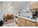 Bright kitchen featuring white countertops, sink, and oak cabinets at 4861 S Torrey Pines Dr # 106, Las Vegas, NV 89103
