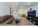 Inviting living room with open concept to kitchen and dining area at 4861 S Torrey Pines Dr # 106, Las Vegas, NV 89103