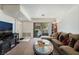 Cozy living room with sliding glass door, comfortable seating, and neutral decor at 4861 S Torrey Pines Dr # 106, Las Vegas, NV 89103