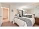 Bedroom showcasing mirrored closet doors, neutral carpet, and access to hallway at 4899 S Torrey Pines Dr # 104, Las Vegas, NV 89103