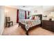 Cozy bedroom with a large bed, dark wood furniture, and a mirrored wall at 4899 S Torrey Pines Dr # 104, Las Vegas, NV 89103