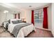 Comfortable bedroom with a large bed, carpet flooring, and lots of natural light from the window at 4899 S Torrey Pines Dr # 104, Las Vegas, NV 89103
