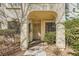 Charming condo features an arched doorway and well-maintained landscaping at 4899 S Torrey Pines Dr # 104, Las Vegas, NV 89103