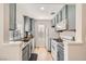 Well-equipped kitchen features granite countertops, stainless steel appliances, and gray cabinets at 4899 S Torrey Pines Dr # 104, Las Vegas, NV 89103