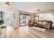 Bright and airy living room featuring hardwood floors, neutral paint, and sliding glass door at 4899 S Torrey Pines Dr # 104, Las Vegas, NV 89103