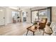 Bright and airy living room featuring hardwood floors, neutral paint, and sliding glass door at 4899 S Torrey Pines Dr # 104, Las Vegas, NV 89103