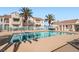 Sparkling community pool with inviting lounge area and lush landscaping at 4899 S Torrey Pines Dr # 104, Las Vegas, NV 89103