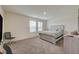 Bedroom features a large window, gray carpet, and a wood paneled bed frame at 542 Foothill Cove Ln, Henderson, NV 89002