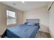 Well-lit bedroom with plush bedding, closet, and window providing natural light and comfort at 542 Foothill Cove Ln, Henderson, NV 89002