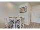 Cozy dining area featuring wood-look flooring, a round table, and four chairs at 542 Foothill Cove Ln, Henderson, NV 89002