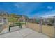 Fenced dog park with bench and waste station, offering a secure area for pet exercise at 542 Foothill Cove Ln, Henderson, NV 89002
