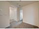 Hallway with grey carpet, doors, and white walls leading to other rooms in the home at 542 Foothill Cove Ln, Henderson, NV 89002