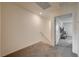 Upstairs hallway showing carpet flooring and white painted walls with a partial staircase at 542 Foothill Cove Ln, Henderson, NV 89002
