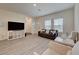 Bright living room with modern decor, ample natural light, and stylish furniture at 542 Foothill Cove Ln, Henderson, NV 89002