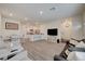 Open-concept living area combining a modern kitchen and living space for seamless living and entertaining at 542 Foothill Cove Ln, Henderson, NV 89002