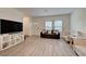 Bright living room with modern vinyl flooring and neutral tones at 542 Foothill Cove Ln, Henderson, NV 89002