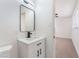 This bathroom's modern vanity features stylish fixtures and new mirror at 6320 Hobart Ave, Las Vegas, NV 89107