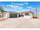 A well-kept single-story home boasts a large two car garage and long concrete driveway at 6320 Hobart Ave, Las Vegas, NV 89107