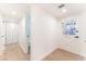 Bright hallway featuring new floors and an ornate security door at 6320 Hobart Ave, Las Vegas, NV 89107