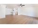 Bright open-concept living space with modern flooring and a stylish ceiling fan at 6320 Hobart Ave, Las Vegas, NV 89107