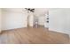 Spacious living room featuring sleek flooring, a modern ceiling fan, and abundant natural light at 6320 Hobart Ave, Las Vegas, NV 89107