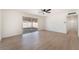Inviting living area with sliding glass doors, modern flooring, and minimalist decor at 6320 Hobart Ave, Las Vegas, NV 89107