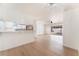 Bright living room featuring sleek hardwood floors and sliding glass doors to a fenced backyard at 6320 Hobart Ave, Las Vegas, NV 89107