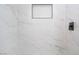 The updated shower has modern tile and a built-in soap nook at 6320 Hobart Ave, Las Vegas, NV 89107