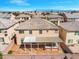 Aerial view of a home showcasing a spacious backyard with patio and pergola at 6335 Mount Eden Ave, Las Vegas, NV 89139