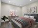 Comfortable bedroom features a neutral color palette and modern decor at 6335 Mount Eden Ave, Las Vegas, NV 89139