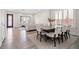 Spacious dining area open to living room, featuring a large table and ample natural light at 6335 Mount Eden Ave, Las Vegas, NV 89139