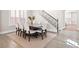 Dining room with hardwood floors, a large table, comfortable seating, and access to other rooms at 6335 Mount Eden Ave, Las Vegas, NV 89139
