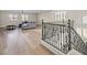 Open-concept living room with wood floors and staircase at 6335 Mount Eden Ave, Las Vegas, NV 89139