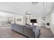 Bright living room featuring a comfortable sectional sofa, entertainment center, and stylish decor at 6335 Mount Eden Ave, Las Vegas, NV 89139