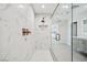 Sleek shower features stylish tiles, elegant bronze fixtures, and a seamless glass enclosure at 6335 Mount Eden Ave, Las Vegas, NV 89139