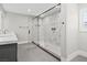 Contemporary bathroom with stylish tiles, sleek fixtures, and a glass-enclosed shower for a spa-like experience at 6335 Mount Eden Ave, Las Vegas, NV 89139