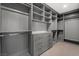Spacious walk-in closet with custom shelving, drawers, and ample hanging space for organized storage at 6335 Mount Eden Ave, Las Vegas, NV 89139