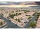 Aerial view of a well-maintained neighborhood featuring tree-lined streets and single-Gathering homes at 6527 Belgrave Hall Ln, Las Vegas, NV 89122