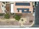 Aerial view of the property showcasing a backyard park, solar panels, and surrounding neighborhood layout at 6527 Belgrave Hall Ln, Las Vegas, NV 89122