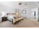 Carpeted bedroom showcasing ample natural light and neutral tones at 6527 Belgrave Hall Ln, Las Vegas, NV 89122