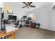 Bedroom features multiple workstations, neutral colors, and a ceiling fan at 6527 Belgrave Hall Ln, Las Vegas, NV 89122