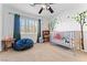 bedroom with a window, carpet, and playful tree decal on the wall at 6527 Belgrave Hall Ln, Las Vegas, NV 89122