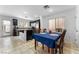 Open kitchen and dining area filled with stainless steel appliances and natural light at 6527 Belgrave Hall Ln, Las Vegas, NV 89122