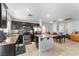 Modern kitchen with stainless steel appliances, granite countertops, and tile flooring at 6527 Belgrave Hall Ln, Las Vegas, NV 89122
