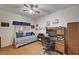 Comfortable bedroom with bright windows, a ceiling fan, and a convenient workspace area at 6705 Squaw Mountain Dr # 102, Las Vegas, NV 89130