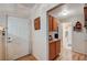 Inviting entryway featuring laminate floors, a storage cabinet, and access to the bathroom at 6705 Squaw Mountain Dr # 102, Las Vegas, NV 89130