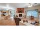 Open-concept living area with a fireplace, dining space, and seamless flow to the modern kitchen, perfect for entertaining at 6705 Squaw Mountain Dr # 102, Las Vegas, NV 89130