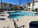 Community pool with a hot tub offers residents a refreshing escape and relaxation with poolside seating for residents' enjoyment at 6705 Squaw Mountain Dr # 102, Las Vegas, NV 89130